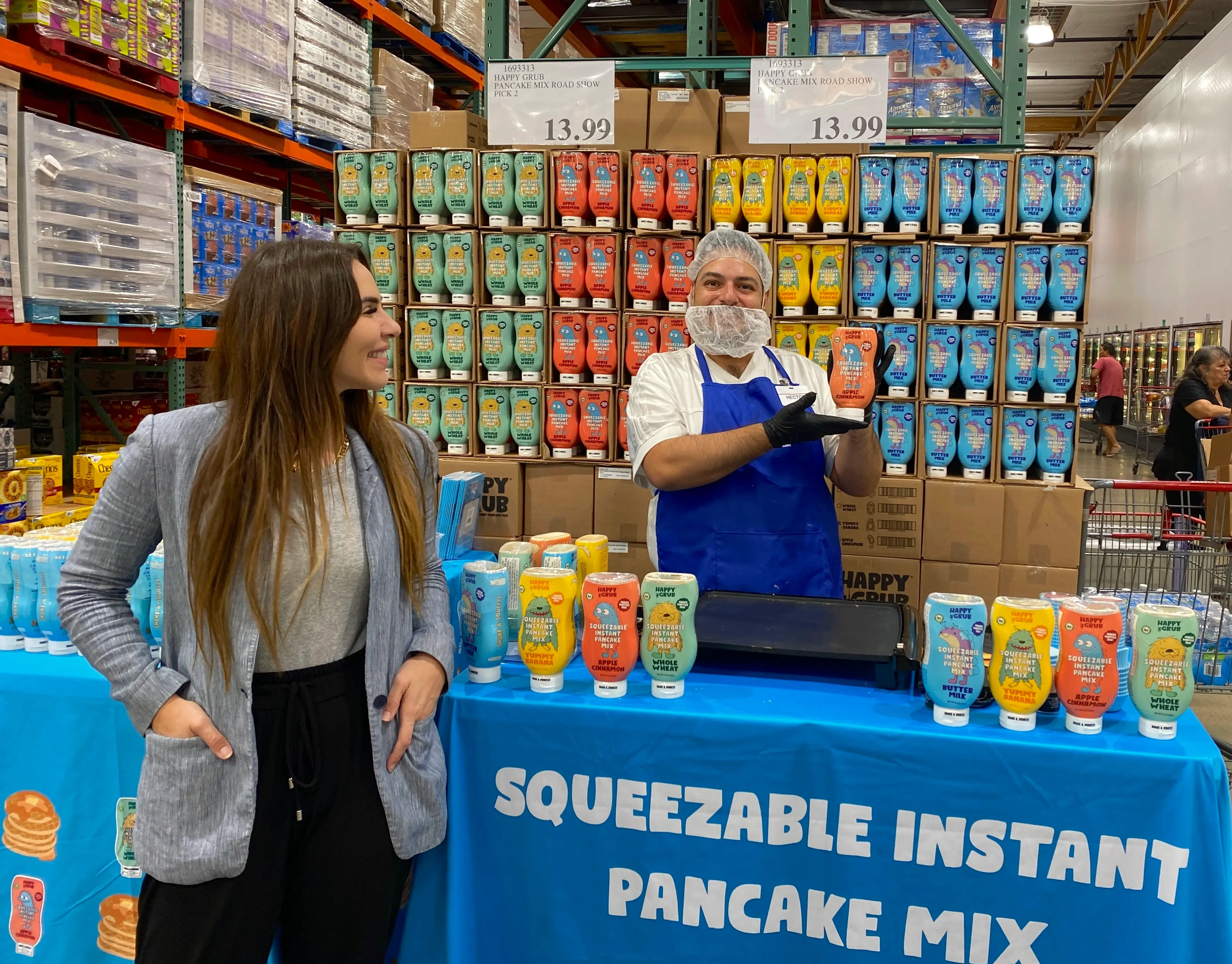 Brand representative engaging with a customer at a warehouse club demo