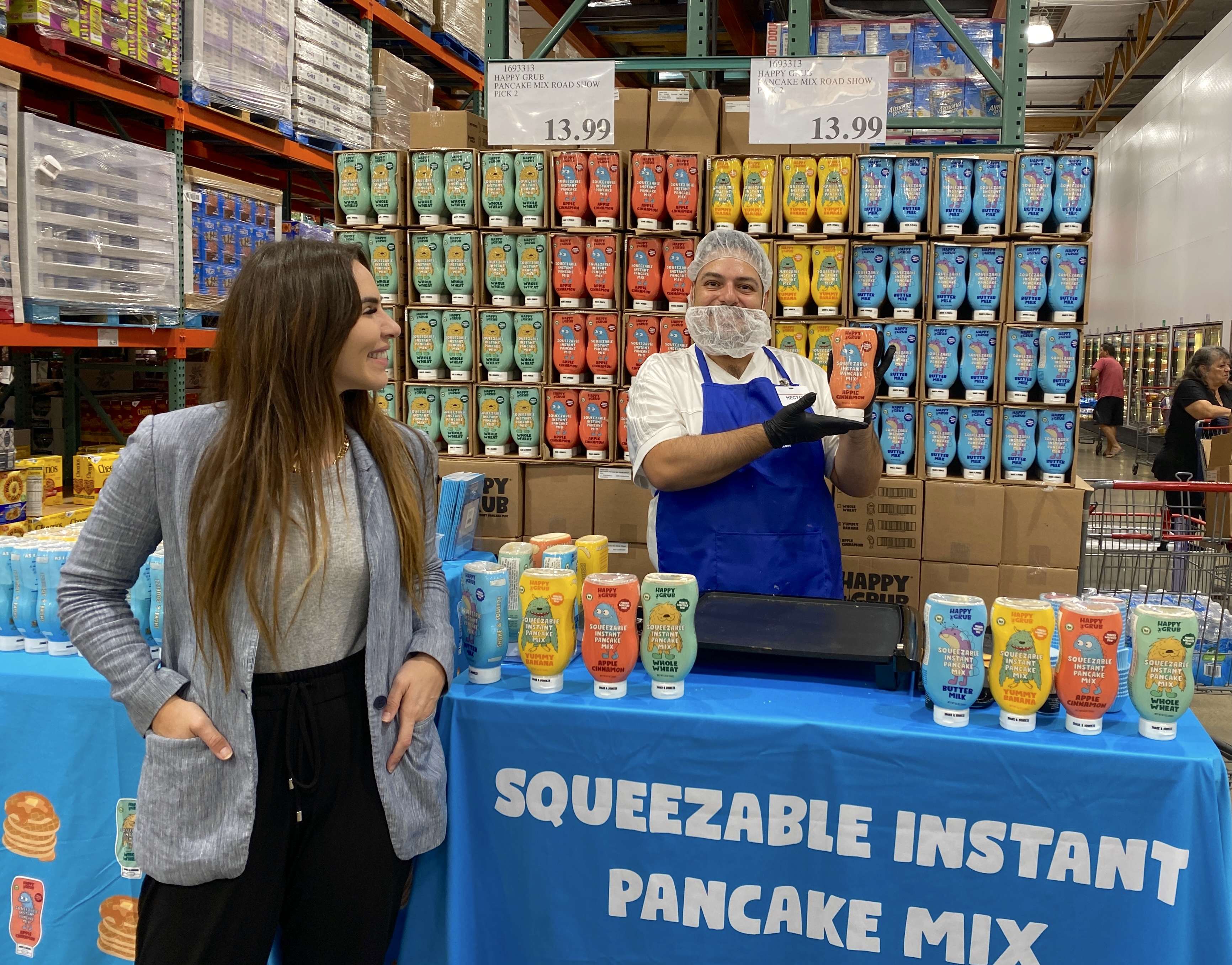 Brand representative engaging with a customer at a warehouse club demo